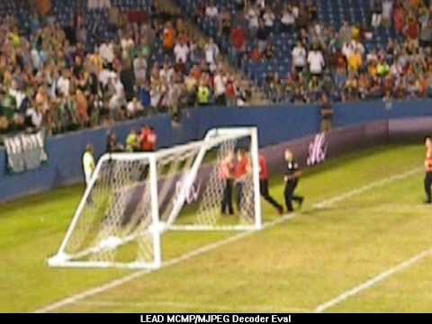 Fans run onto the field during AC Milan game