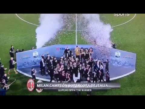 AC Milan's players lift the trophy